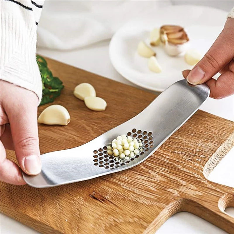 Easy Mincing Organic Garlic Using Two Hand Stainless Steel Garlic Press From Terra Powders