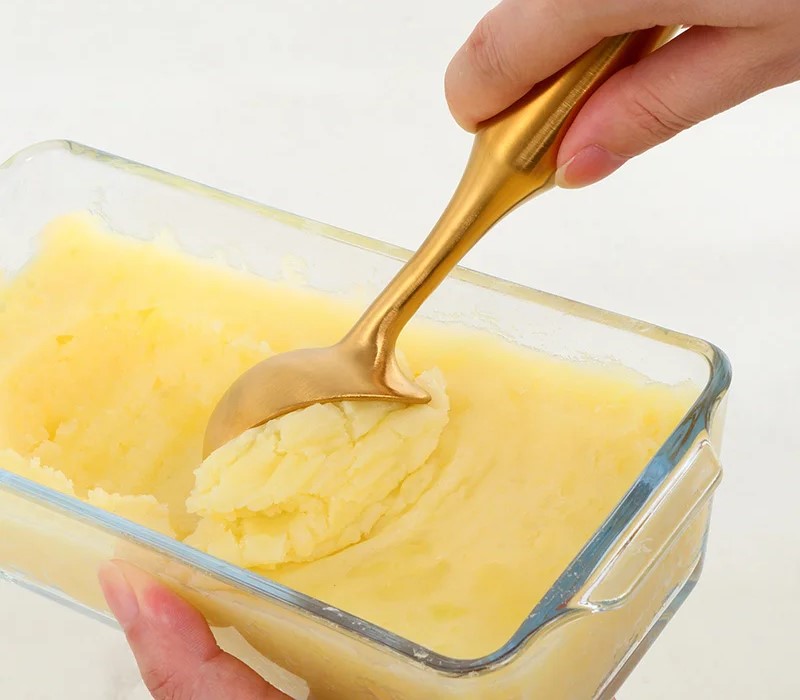 Scooping Frozen Sherbet Dessert Using Gold Metal Stainless Steel Ice Cream Scoop