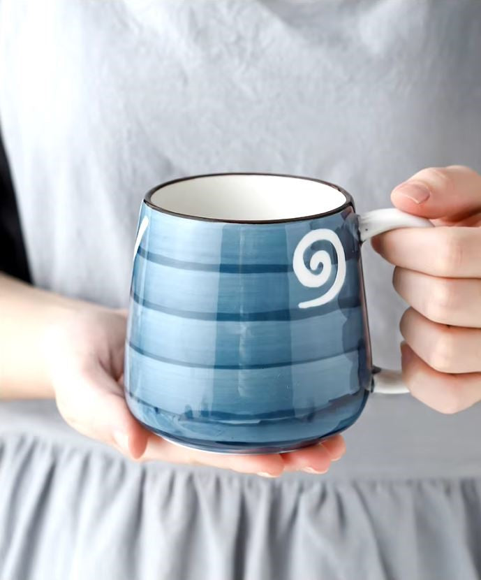 Holding Nautilus Mug Ceramic Drinkware In Nautical Styles Hand Painted Pottery