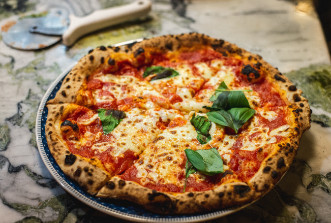 Delicious Fresh Homemade Pizza Topped With Organic Basil