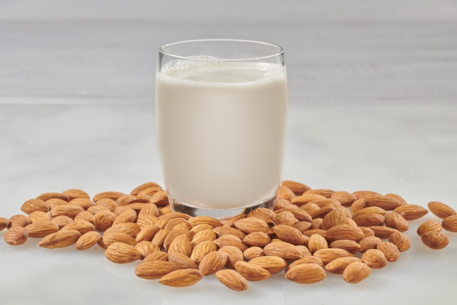 Organic Almonds And Glass Of Better Than Milk Unsweetened Almond Drink